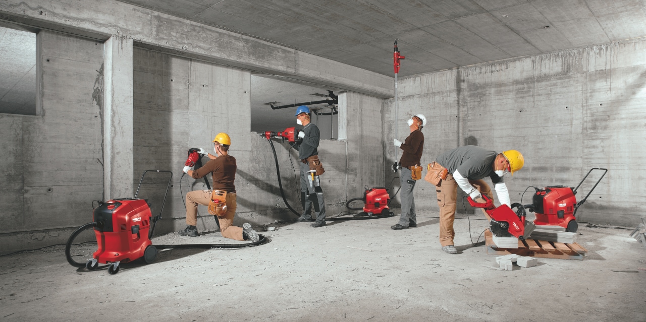 Image of all the full portfolio of Hilti vacuum cleaners being used on the construction site